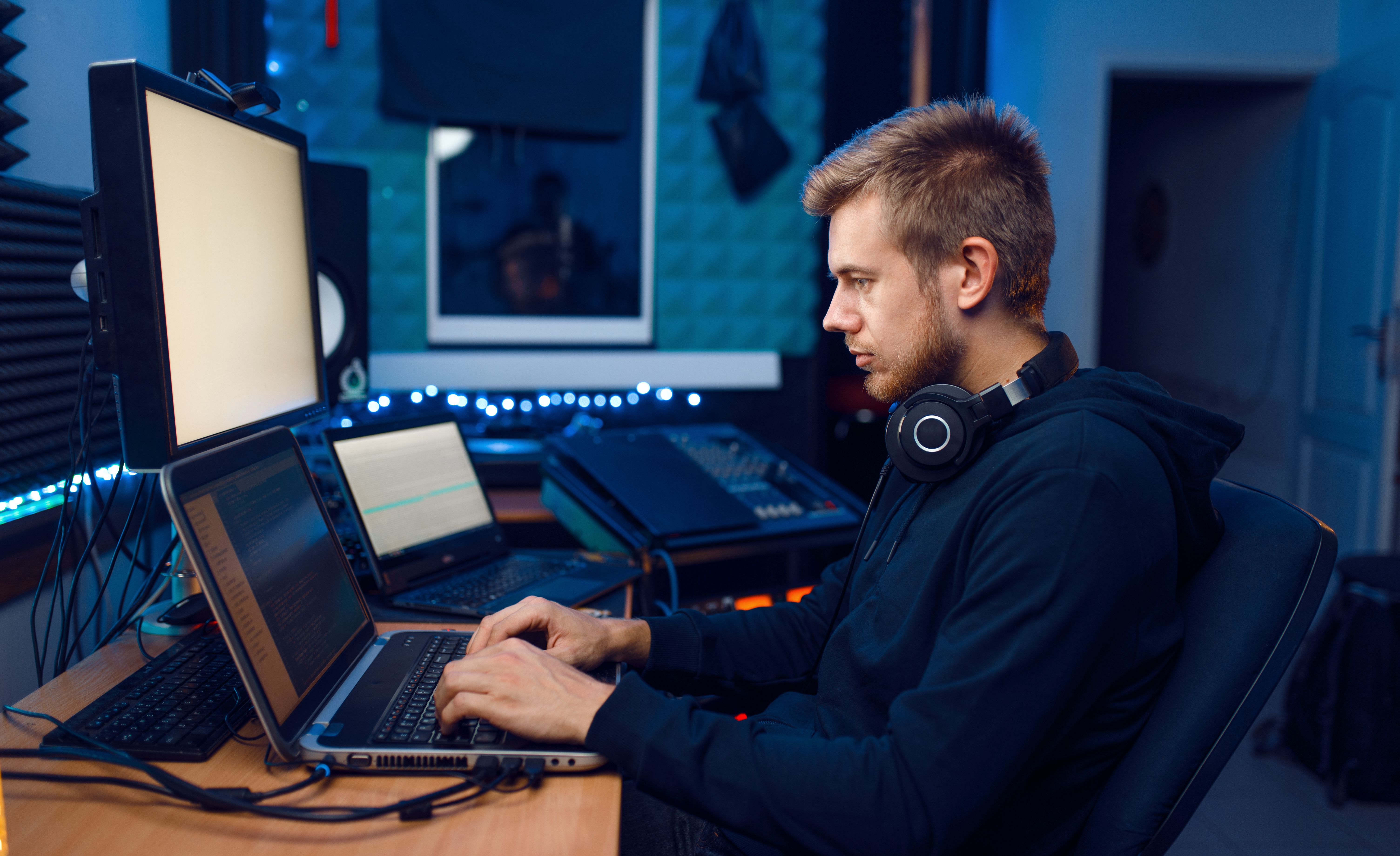 Programmer working on laptop, computer technology